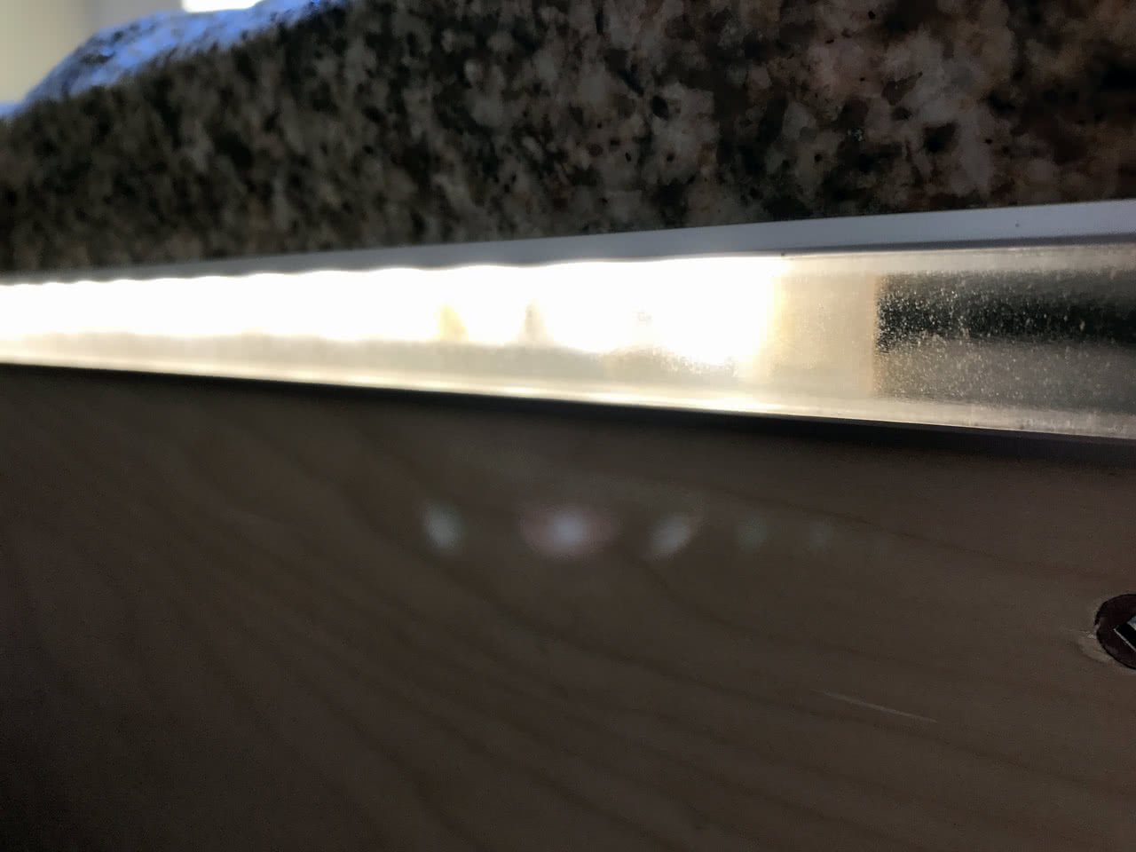 Under countertop lights illuminate drawer space or floor beneath